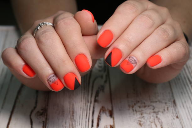 istock Multi-colored pastel manicure combined tone on tone with a striped background.Nail art 1151655678