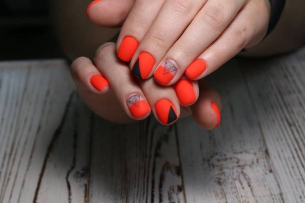 istock Multi-colored pastel manicure combined tone on tone with a striped background.Nail art 1151655718