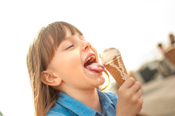 istock Little girl eating ice cream 1151658607