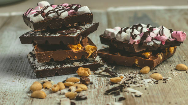 istock Blocks of rustic chocolate with nuts, coconut, honeycomb and marshmallows. 1151666586