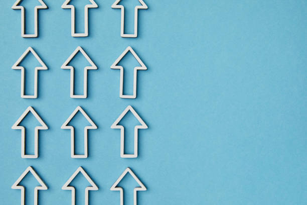 istock top view of vertical rows white arrows on blue background 1151668438