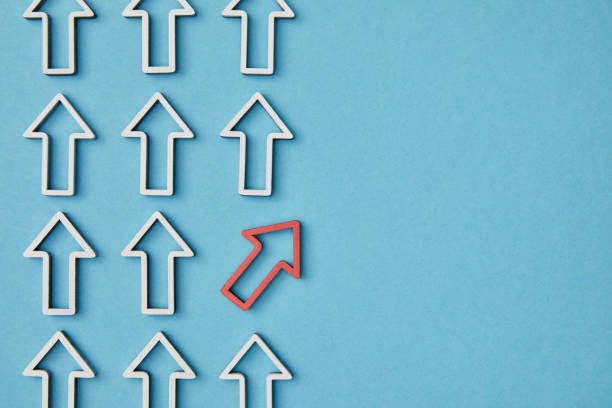 istock top view of vertical rows with white arrows and red pointer on blue background 1151668440