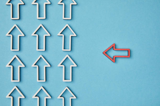 istock top view of horizontal red arrow pointing to vertical pointers rows on blue background 1151668442