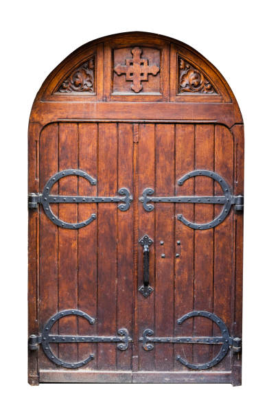 istock Antique, wooden, bicuspid, arched, closed doors with a forged iron elements isolated on a white background. 1151668592