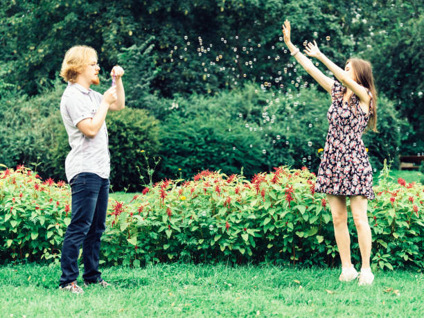 istock Couple blowing bubbles outdoor 1151669630