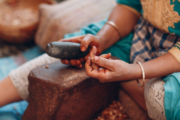 istock Woman making argan oil by hand craft 1151669653