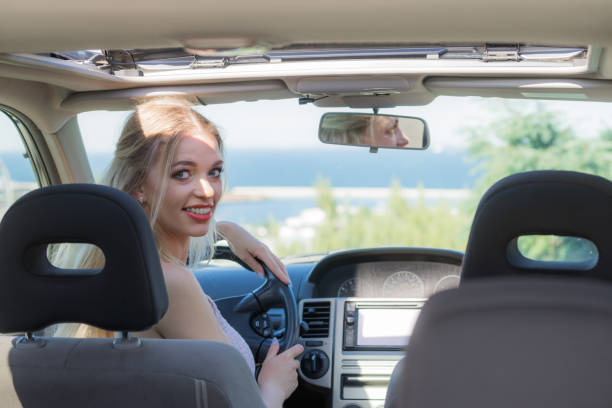istock Young driver woman behind steering wheel 1151669915