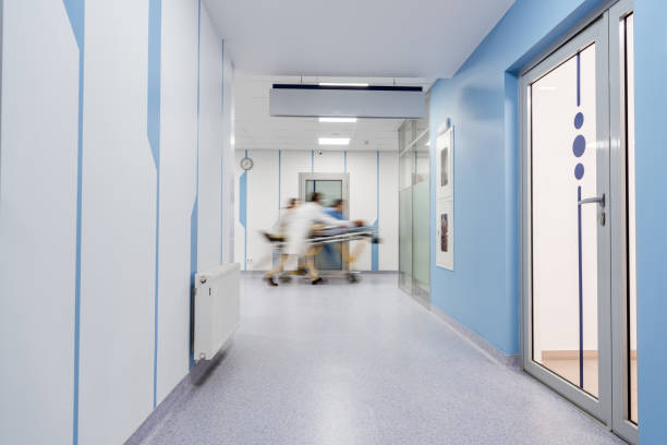 istock Group of doctors transportating patient on gurney 1151672484