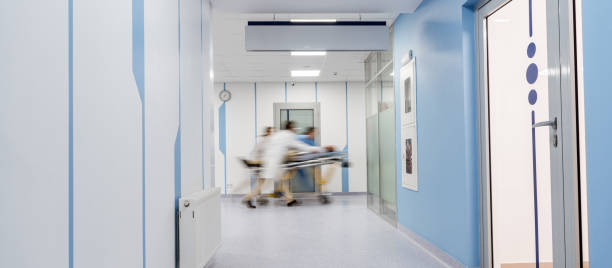 istock Group of doctors transportating patient on gurney 1151672486