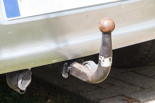 Close-up on the trailer hitch ball of a car