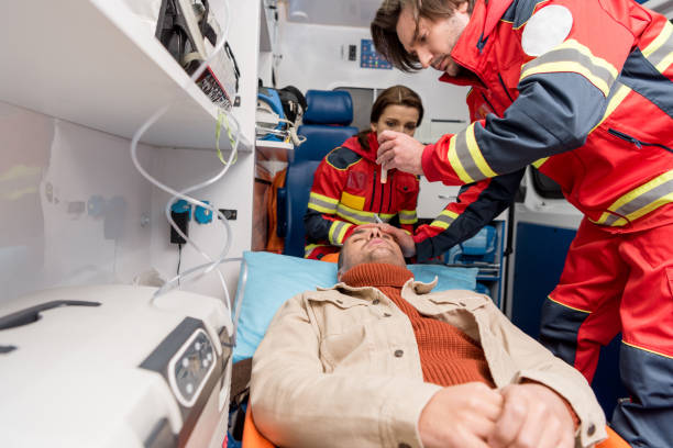 istock Paramedics doing eye examining in ambulance car 1151675485