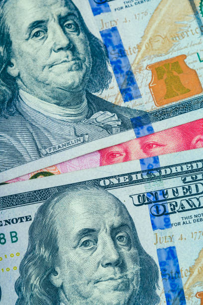 istock 100 US dollar and Chinese Yuan 1151677215