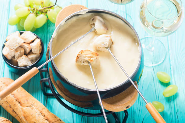 istock Cheese fondue with bread wine and grape 1151679732