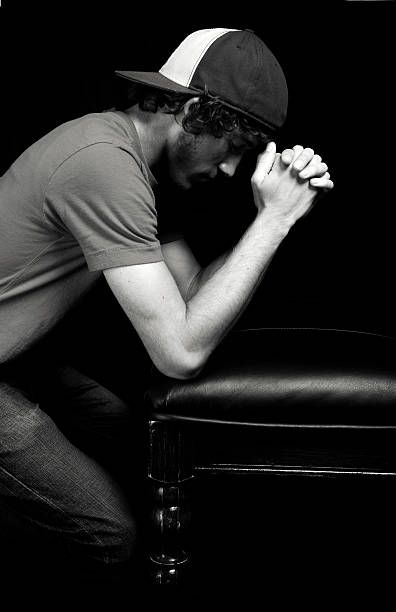 istock young male prayer portrait 115168106