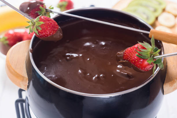 istock Chocolate fondue whith fruit and berries 1151681396