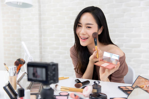 istock Beautiful Asian woman professional beauty vlogger recording make up tutorial video 1151683325