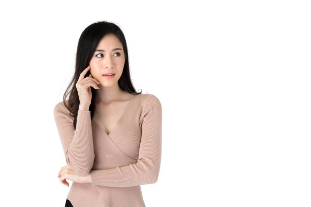 istock Beautiful asian woman in a thinking gesture 1151683342