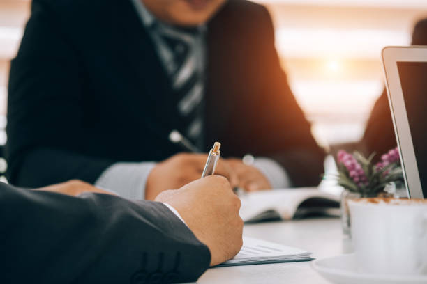 istock Business people analyzing investment graph meeting brainstorming and discussing plan in meeting room, investment concept 1151700799