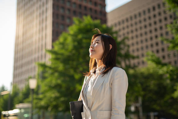 istock Businesswoman looking up at sky 1151706412