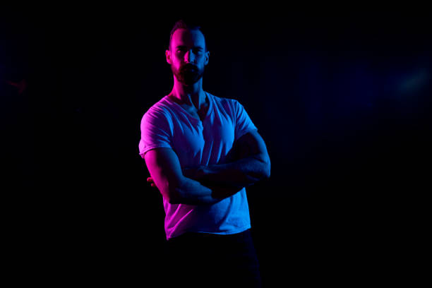 istock Handsome man in white tshirt with gel lighting 1151707246