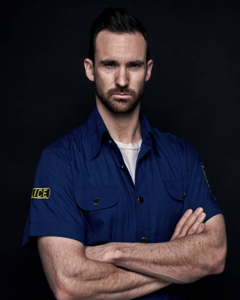 istock Handsome man wearing police uniform 1151707357