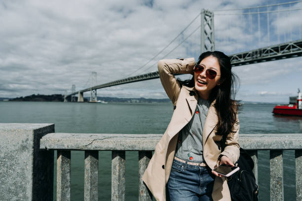 istock asian woman charming smiling relying on handrail 1151708262