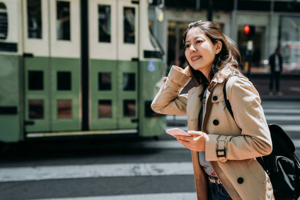 istock teenager  holding cellphone searching plan route 1151708357