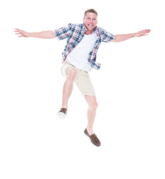 istock Handsome man in shirt and shorts is jumping 1151708428