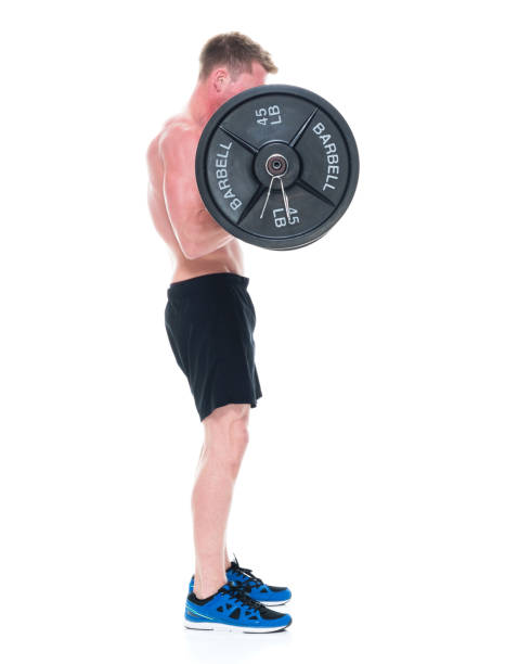 istock Attractive shirtless man lifting heavy weights, side view 1151709682