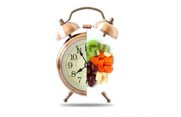 istock Antique clock needles Fruit healthy. Healthy food concept. 1151715542
