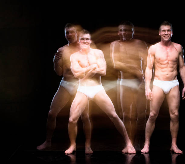 istock Man in underwear moving around creating a blur image 1151715823