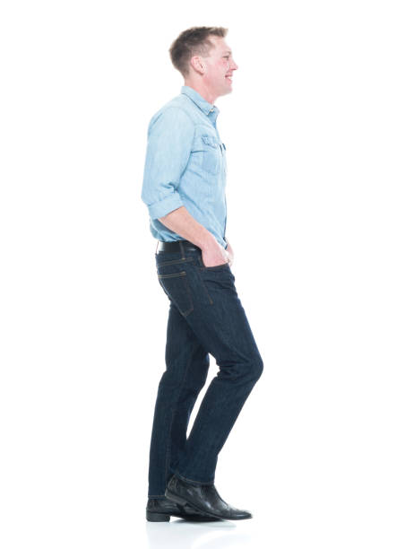istock Handsome man with hands in pocket and walking 1151716487