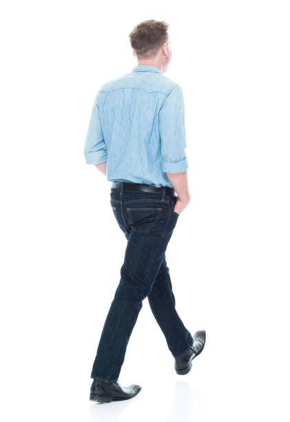 istock Handsome man with hands in pocket and walking 1151716521