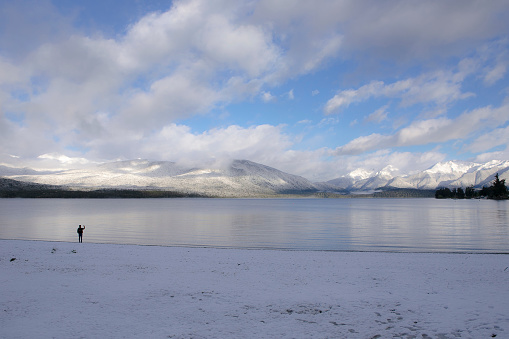 when sunrise a man walking alone at Te anau Lake, winter season