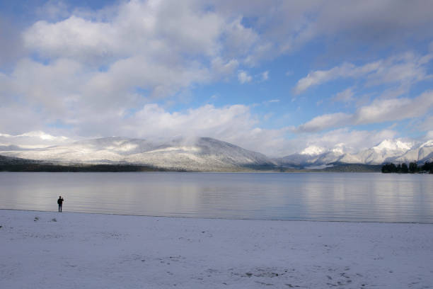 when sunrise a man walking alone at Te anau Lake, winter season