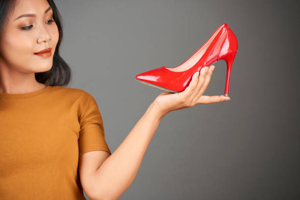 istock Fashionista choosing pumps 1151723034