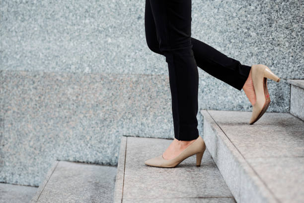 istock Woman standing on stairs 1151723703