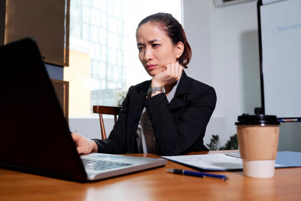 istock Frowning businesswoman reading e-mail 1151723722