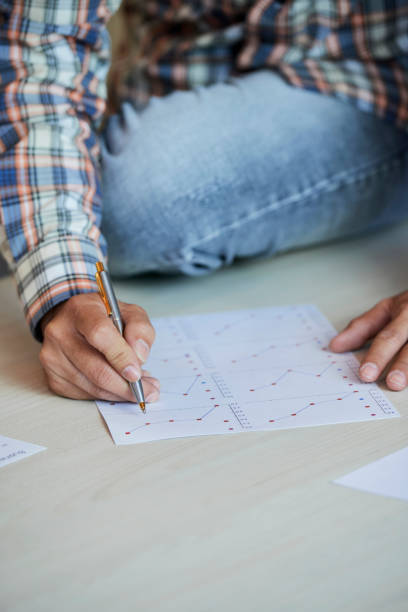 istock Businessman examining report 1151724034