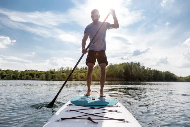 Stand up paddling on a lake