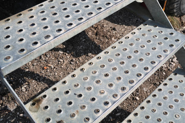 stairs with antislip steps of perforated metal at construction site