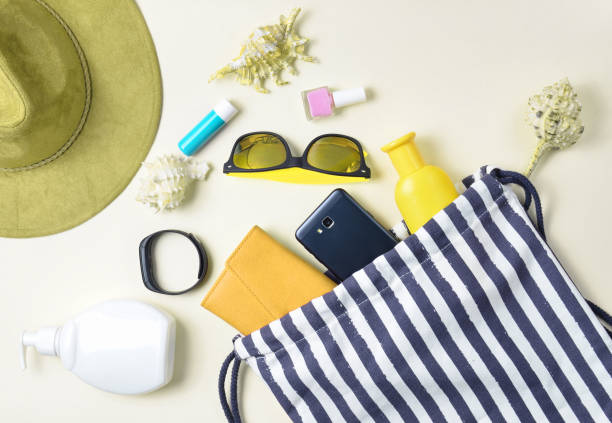 istock Beach bag and accessories for relaxing on the beach layout on white background. The concept of the resort at sea, summer time. Top view, flat lay, minimalism 1151729105