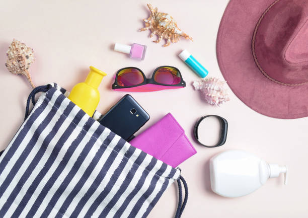 istock Beach bag and accessories for relaxing on the beach layout on white background. The concept of the resort at sea, summer time. Top view, flat lay, minimalism 1151729111