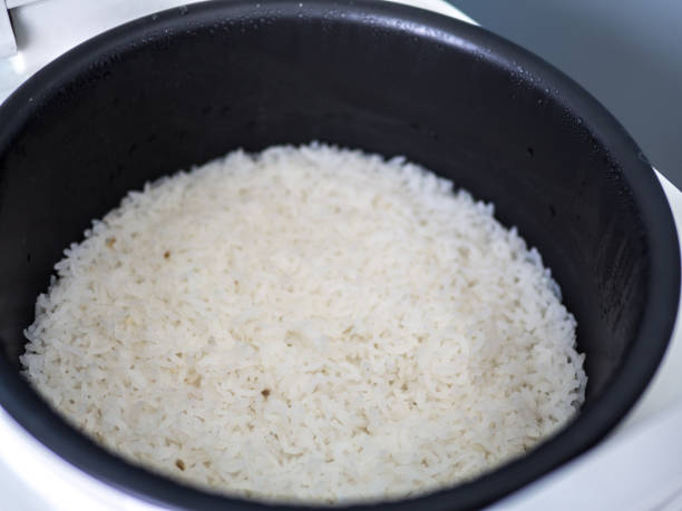 istock Steam rice in electronic cooker. 1151730135