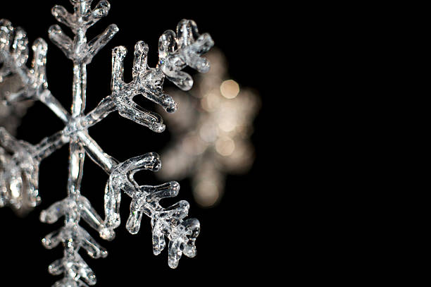 icy snowflake on black icy snowflake ornaments on black background for winter Thanksgiving and Christmas holiday season icicle snowflake winter brilliant stock pictures, royalty-free photos & images