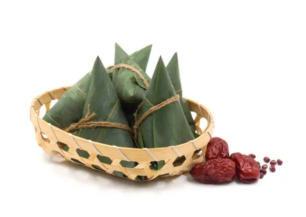 Photo of traditional wrapped rice dumplings  isolated on white background.