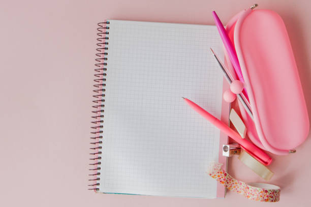 istock Back to school. Notebook, pencil case with pen and pencils on pink background 1151735684