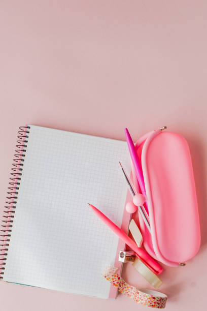 istock Back to school. Notebook, pencil case with pen and pencils on pink background 1151735692