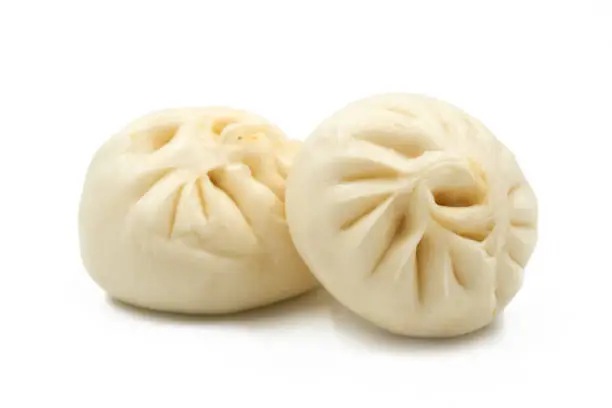 Photo of Chinese Steamed Buns isolated on white background.