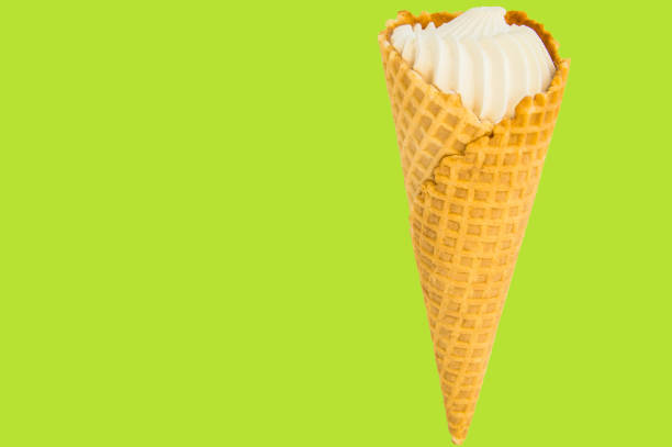 istock Vanilla ice cream on summer green-lemon background. Copy space, text space, layout 1151737277